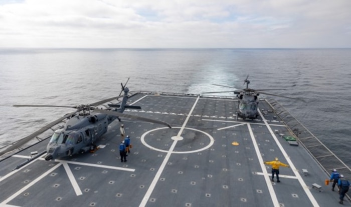 U.S. Air Force HH-60W Jolly Green II helicopters assigned to the 943d Rescue Group sit aboard littoral combat ship USS Tulsa (LCS 16)
