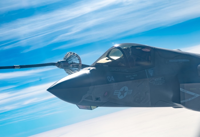 A U.S. Marine Corps F-35B Lightning II aircraft receives fuel from an HC-130J Combat King II aircraft