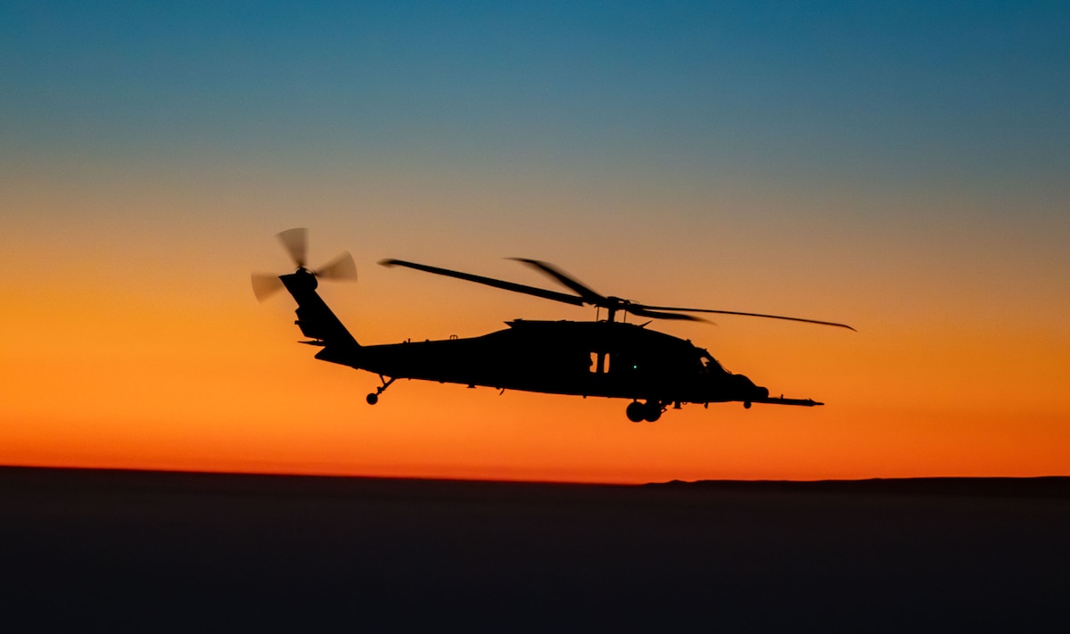 A U.S. Air Force HH-60W Jolly Green II helicopter flies off the coast of California