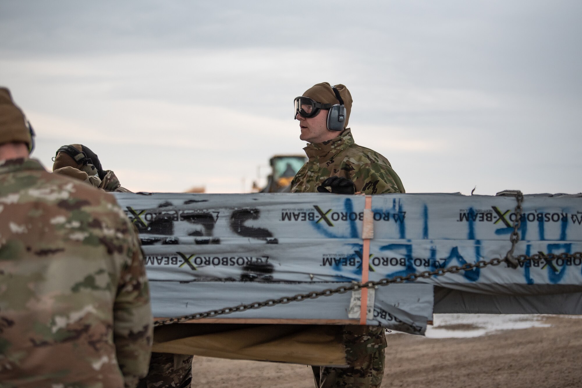 Senior Master Sgt. Gabe Kessler, an aerial port supervisor with the Kentucky Air National Guard’s 123rd Airlift Wing, assists with a combat offload of cargo from a C-130J Super Hercules aircraft in Wainwright, Alaska, as part of Operation Arctic Haven Sept. 2, 2024. Thirty-six wing members supported the Innovative Readiness Training mission, which airlifted 39 short tons of residential building supplies to two remote villages in northern Alaska. (U.S. Air National Guard photo by Tech. Sgt. Chloe Ochs)