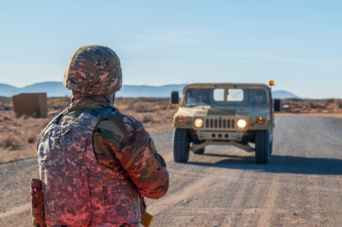 A U.S. Air Force Airman assigned to the 13th Combat Air Base Squadron stares down a Humvee driven by simulated opposing forces during the final combat training exercise of the 13th CABS first Air Task Force training event, Dec. 15, 2024, at Camp McGregor, New Mexico.