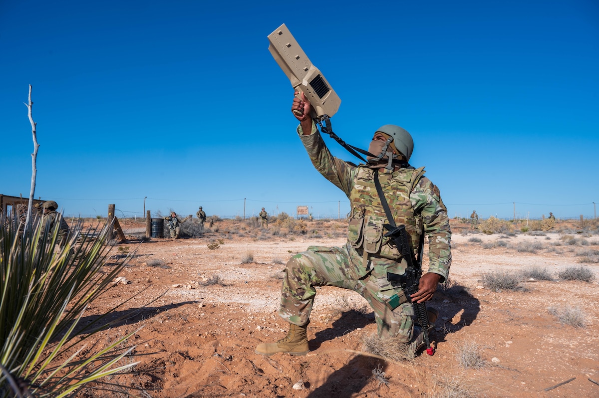 A U.S. Air Force Airman assigned to the 13th Combat Air Base Squadron utilizes a Dronebuster Block 3B during a simulated unmanned aerial systems attack during the 13th CABS first Air Task Force training event, Dec. 13, 2024, at Camp McGregor, New Mexico.