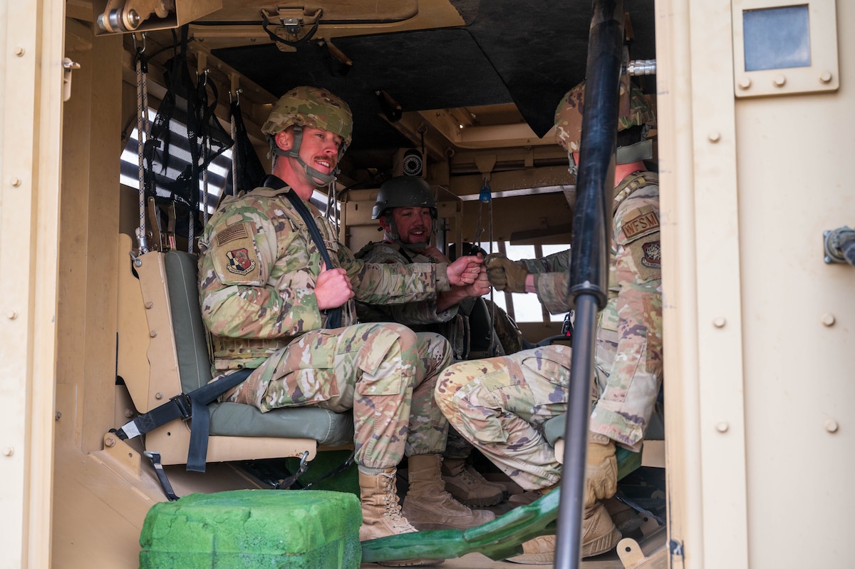 U.S. Air Force Airmen assigned to the 13th Combat Air Base Squadron hype each other up before participating in vehicle rollover training during the 13th CABS first Air Task Force training event, Dec. 6, 2024, at Fort Bliss, Texas.