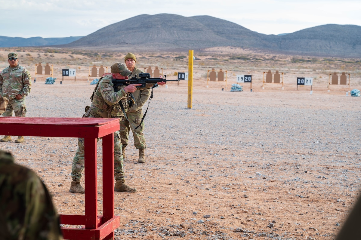 U.S. Air Force Master Sgt. Spencer Coelho-Whipple, 56th Security Forces Squadron operations noncommissioned officer in charge, demonstrates firing drills to Airmen of the 13th Combat Air Base Squadron during their first Air Task Force training event, Dec. 5, 2024, at Camp McGregor, New Mexico.