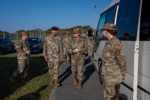 Service members speaking to each other.