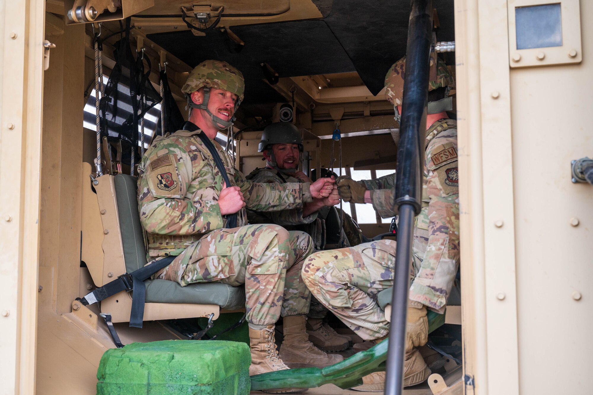 U.S. Air Force Airmen assigned to the 13th Combat Air Base Squadron hype each other up before participating in vehicle rollover training during the 13th CABS first Air Task Force training event, Dec. 6, 2024, at Fort Bliss, Texas.