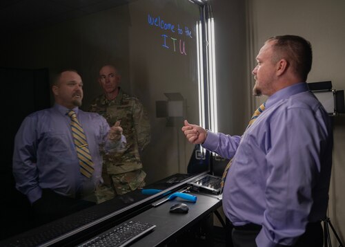U.S. Air Force Maj. Gen. Clerk Quinn, Air Education and Training Command deputy commander, learns about the newest technology at 17th Training Support Squadron’s Instructional Technology Unit during a visit to Goodfellow Air Force Base, Texas, Dec. 17, 2024. ITU aims to keep Airmen informed and mission-ready as they transition to their operational units. (U.S. Air Force photo by Senior Airman Sarah Williams)