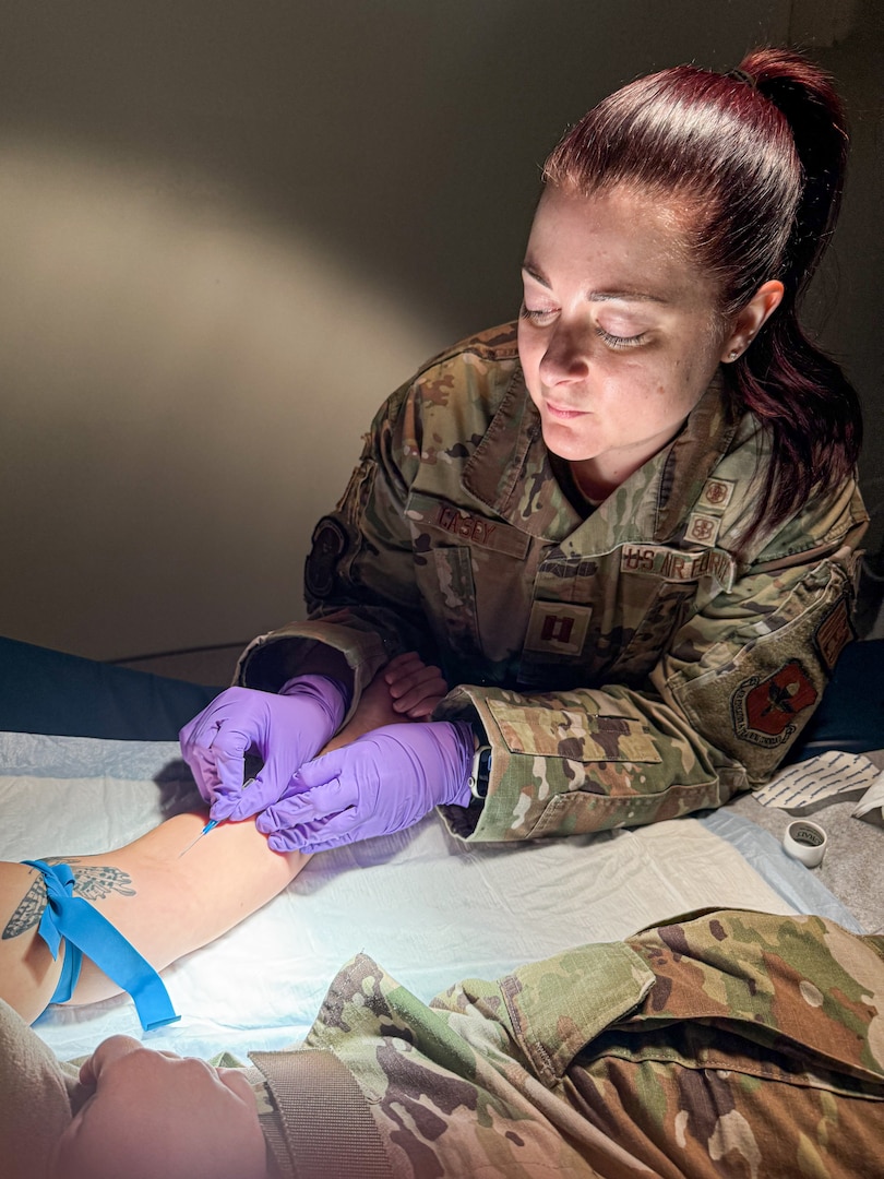 U.S. Air Force Capt. Jessica Casey, 42nd Medical Group registered nurse, starts an IV on a patient at Maxwell Air Force Base, Alabama, Dec.19, 2024