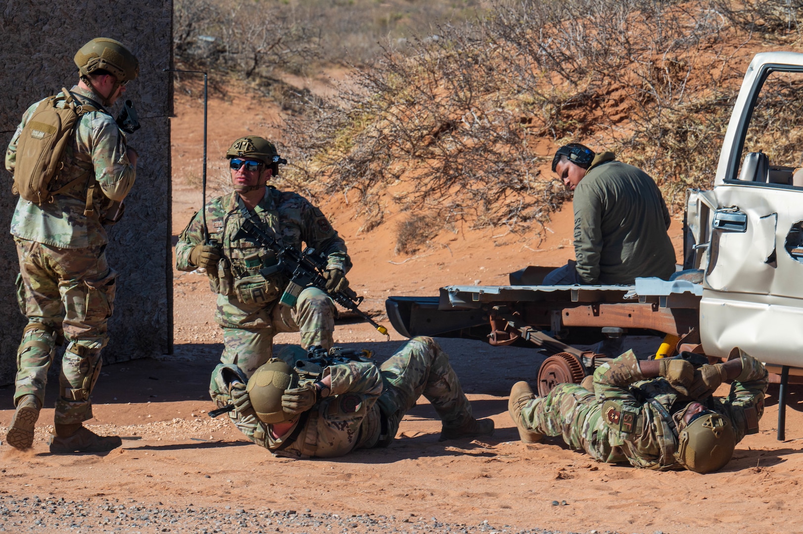 U.S. Air Force security forces Defenders assigned to the 13th Combat Air Base Squadron plan to evacuate two simulated casualties during the 13th CABS first Air Task Force training event, Dec. 14, 2024, at Camp McGregor, New Mexico.