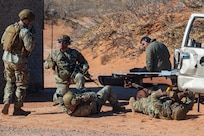 U.S. Air Force security forces Defenders assigned to the 13th Combat Air Base Squadron plan to evacuate two simulated casualties during the 13th CABS first Air Task Force training event, Dec. 14, 2024, at Camp McGregor, New Mexico.