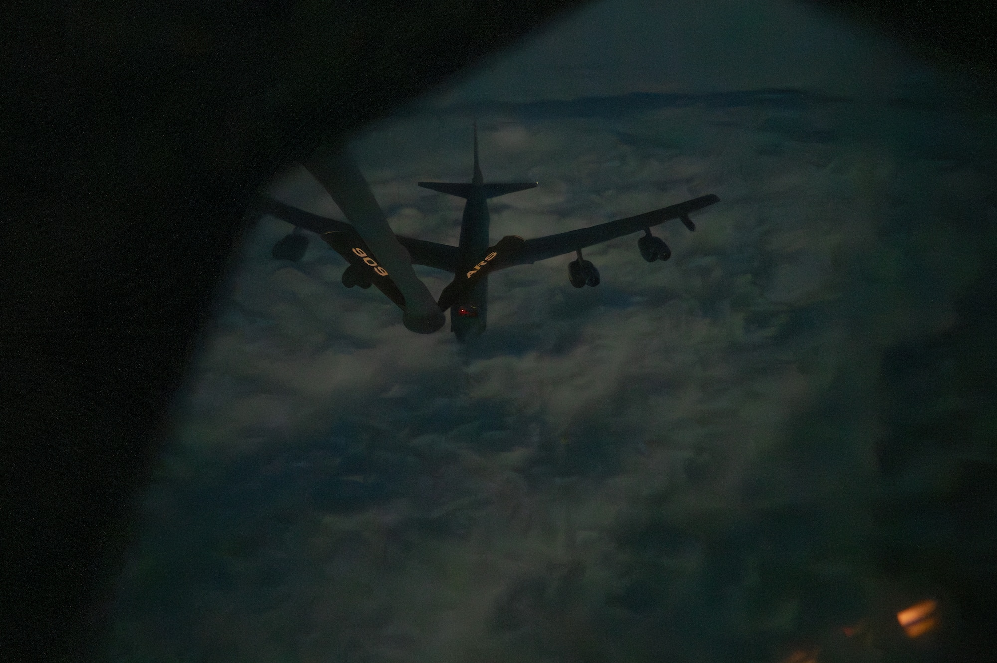 A B-52 disengages from a refueling boom.