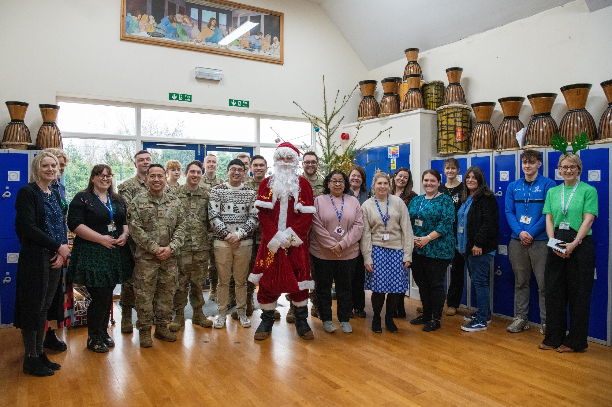 Santa Claus and Airmen pose for a group photo