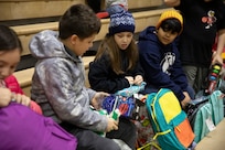 Approximately 50 Alaska National Guard service members, volunteers from the Salvation Army, AKNG Child and Youth Program and others visited the southeastern Alaskan city of Yakutat, Dec. 18, 2024.