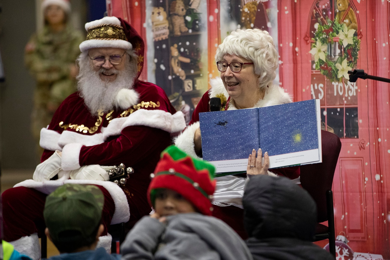 Mrs. Claus reads to the children of Yakutat in their school gymnasium as part of Operation Santa Claus in Yakutat, Alaska, Dec. 18, 2024.