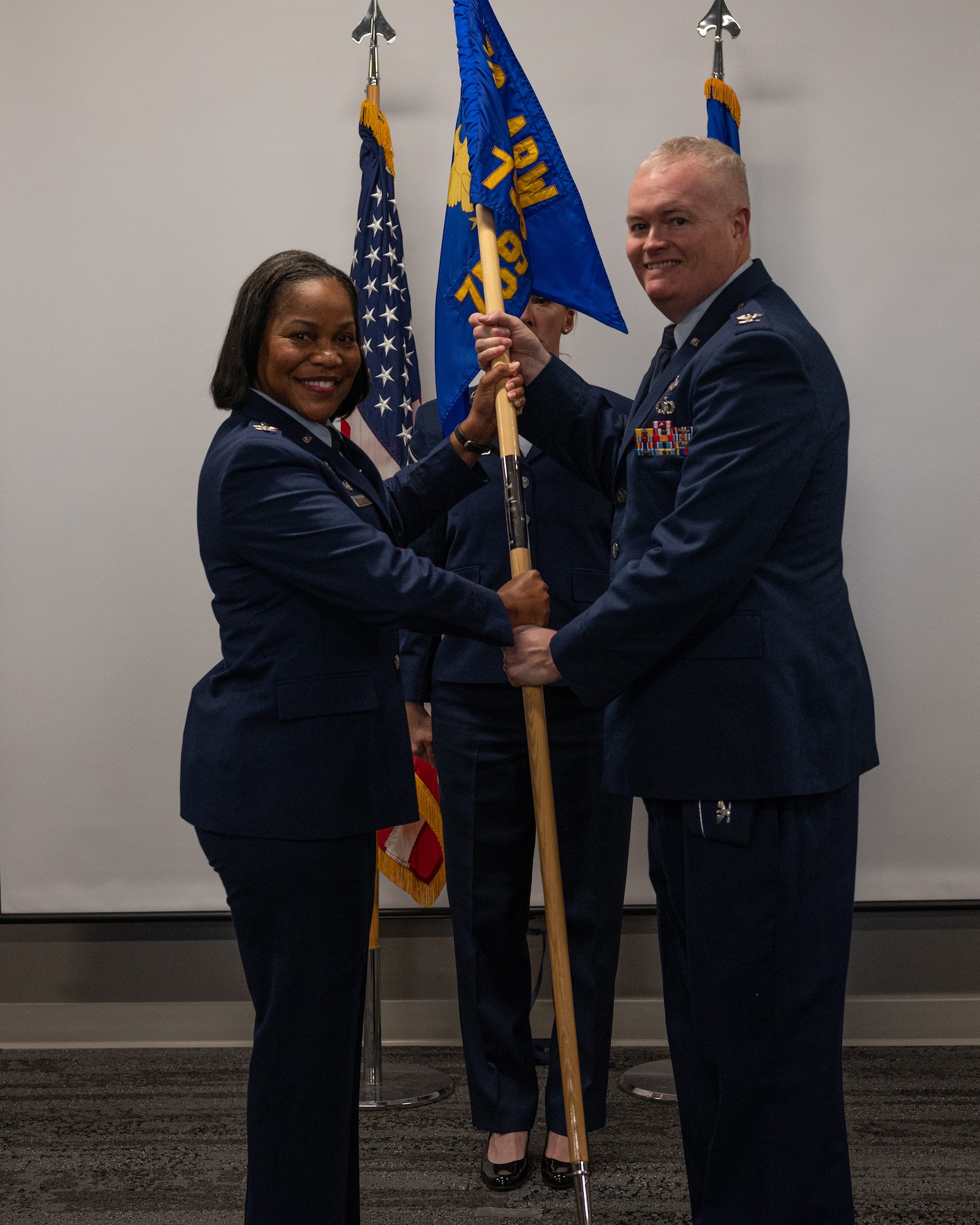 Colonel Justin Cooper (right) takes command of the 759th Logistics Readiness Flight during the unit's assumption of command ceremony held at the 459th Air Refueling Wing on December 8, 2024. Colonel Vianesa Vargas, 459th Mission Support Group Commander, was the presiding official. (U.S. Air Force Photo by Senior Airman Alexcia Givens)