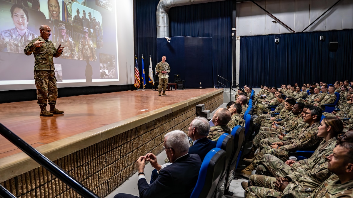 Air Force Chief of Staff Gen. David Allvin, left, and Chief Master Sgt. of the Air Force David Flosi engage with Airmen.