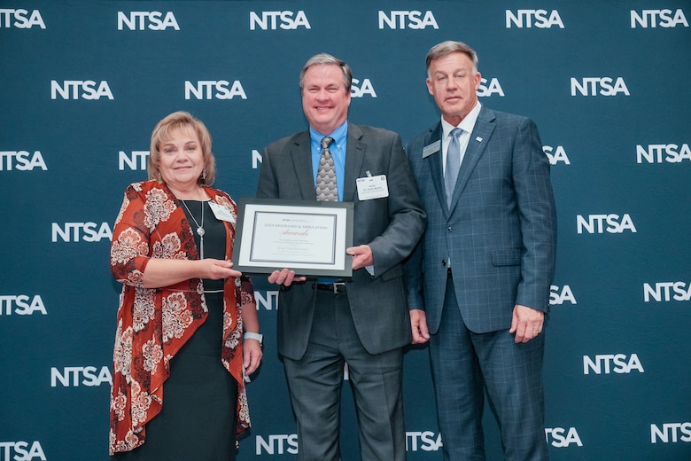 Researchers from the U.S. Army Engineer Research and Development Center’s Watercraft and Ship Simulation team accept the 2024 National Training and Simulation Association Modeling and Simulation Award.