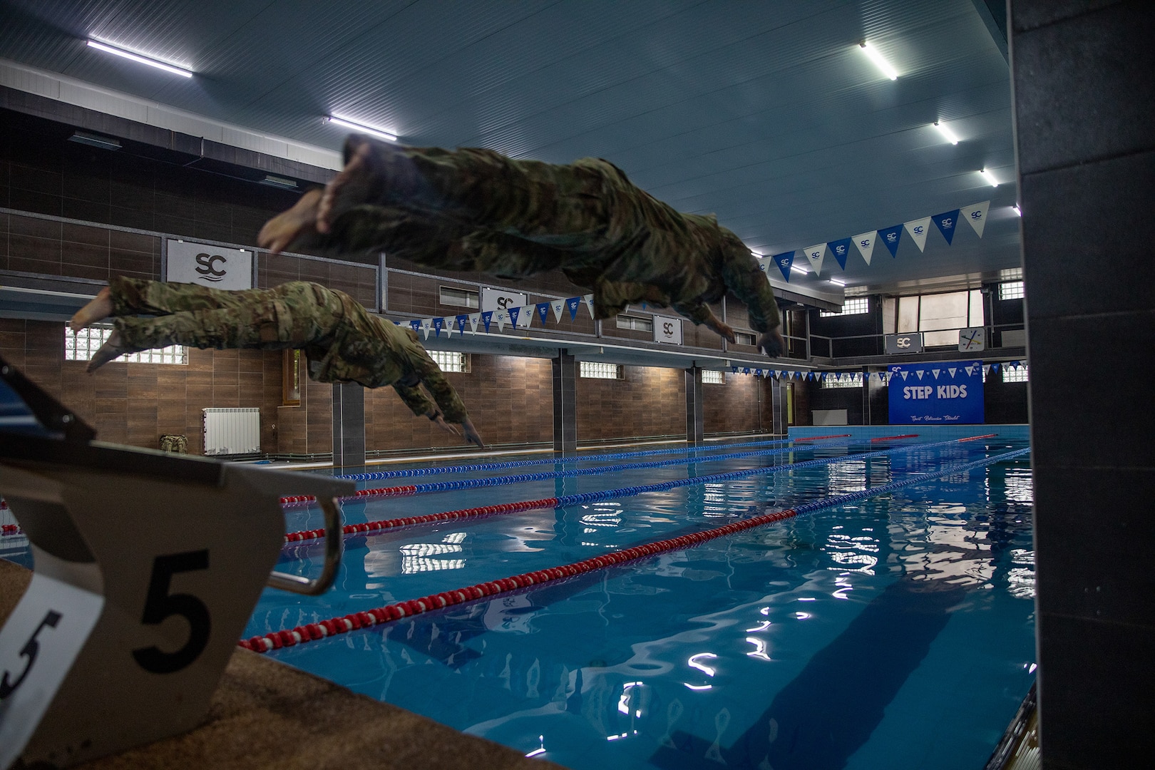 U.S. Army National Guard Soldiers participate in the swimming portion of the German Armed Forces Proficiency Badge event held in Kosovo, Dec. 15, 2024.