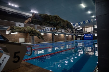 U.S. Army National Guard Soldiers participate in the swimming portion of the German Armed Forces Proficiency Badge event held in Kosovo, Dec. 15, 2024.