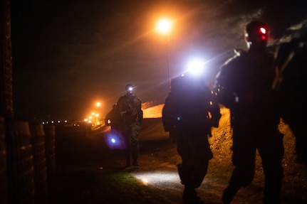 Multinational soldiers assigned to Kosovo Force 34 Regional Command-East participate in the road march portion of the German Armed Forces Proficiency Badge event held on Camp Novo Selo, Kosovo, Dec. 15, 2024.