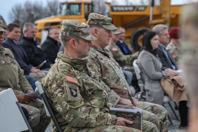 Army Command Sgt. Maj. Jesse Withers, the State Command Sergeant Major and Air Force Col. Ash Groves, Director of Staff for the Kentucky Air National Guard, sit in the crowd during the groundbreaking ceremony of the new multi-purpose machine gun range on Wendell H. Ford Regional Training Center in Greenville, Ky. Dec. 13, 2024.