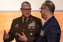 Lt. Gen. Paul A. Chamberlain, Military Deputy to the Assistant Secretary of the Army for Financial Management and Comptroller, talks with Mr. William Gable, U.S. Army Audit Agency chief of staff, during the Army’s Annual Audit Summit at the Mark Center in Alexandria, Virginia, Dec. 10, 2024. More than 400 finance and comptroller professionals from around the Army and across all three components joined more than 800 participants online for the summit this year. (U.S. Army photo by Mark R. W. Orders-Woempner)