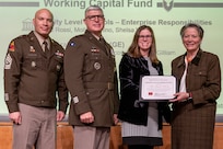 Caral E. Spangler, Assistant Secretary of the Army for Financial Management and Comptroller, along with Lt. Gen. Paul A. Chamberlain, Military Deputy to the ASA (FM&C), and Sgt. Maj. Terry L. Anderson, ASA (FM&C) senior enlisted advisor, present Amanda McCoy, U.S. Army Financial Management Command Army Accounting and Audit Operations Fund Balance with Treasury division chief, with a certificate of appreciation during the Army’s Annual Audit Summit at the Mark Center in Alexandria, Virginia, Dec. 10, 2024. McCoy’s and her team’s efforts helped the Army downgrade the FBwT General Fund material weakness in Fiscal Year 2024. (U.S. Army photo by Mark R. W. Orders-Woempner)