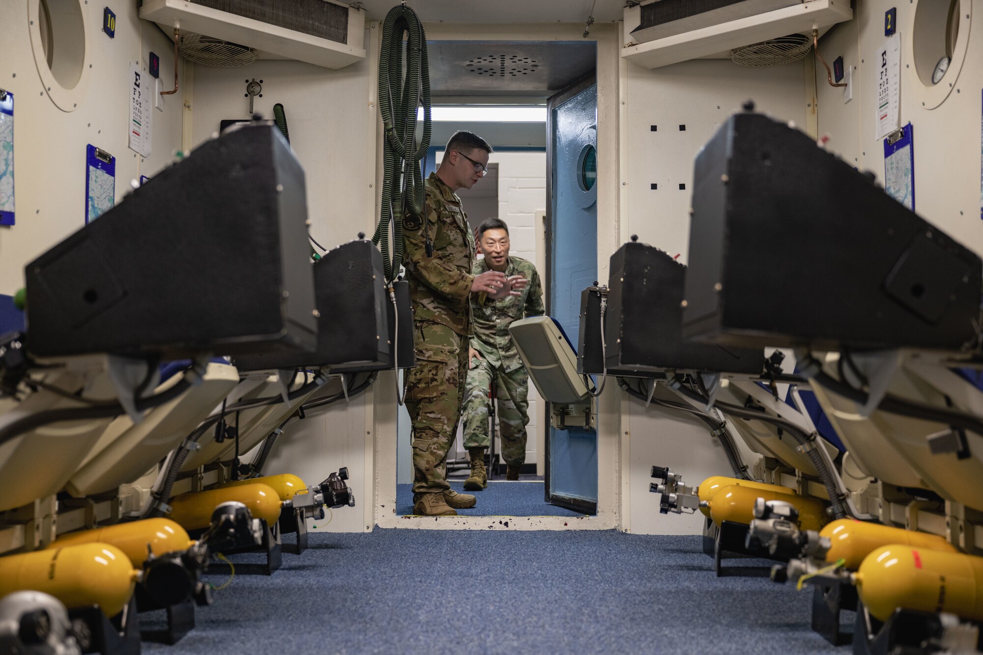 Staff Sgt. Jordan Addison, walks into the altitude chamber.