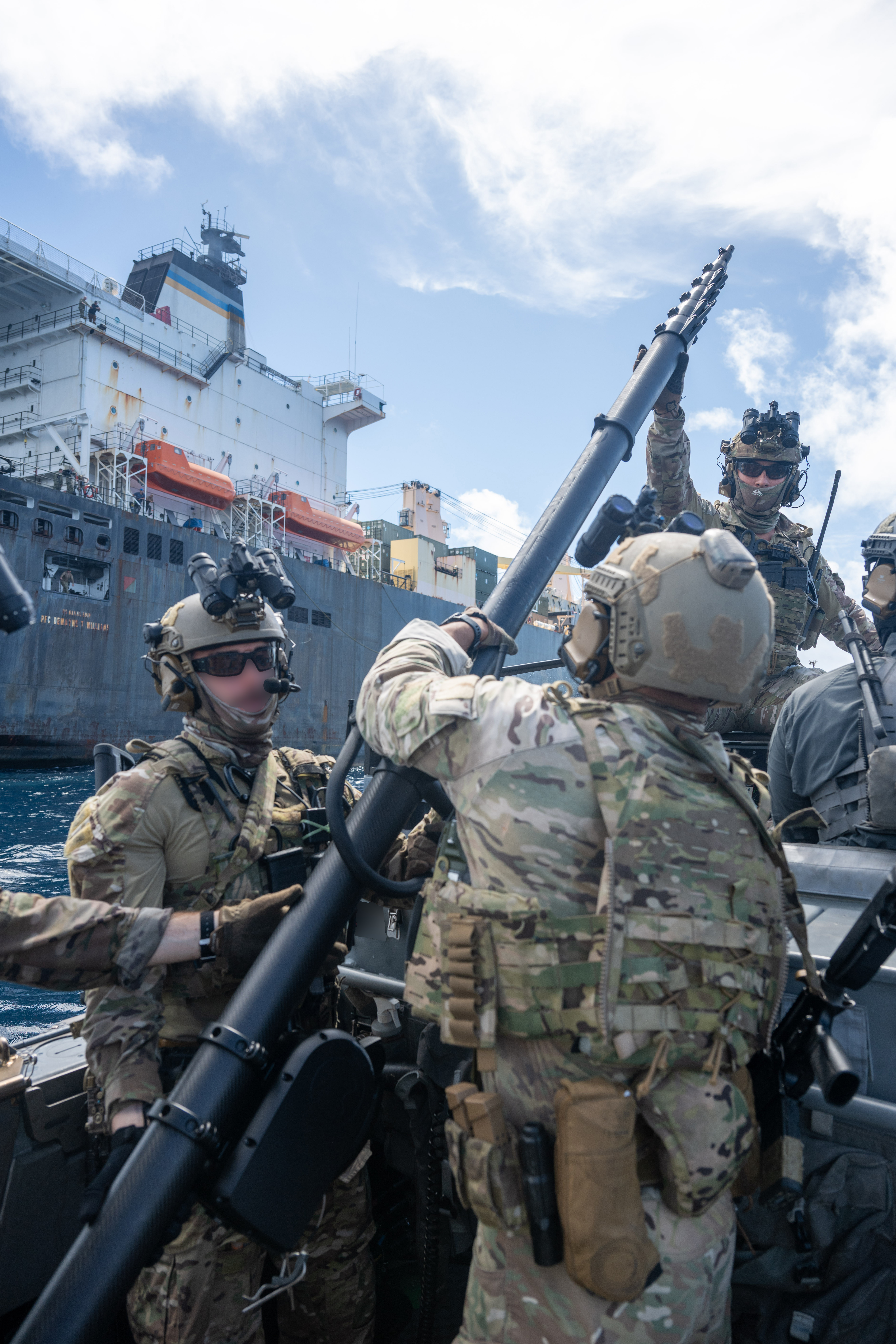 U.S. Naval Special Warfare operators and U.S. Coast Guard Maritime Security Response Team (West) members conduct visit, board, search, and seizure training aboard the 2nd Lt. John P. Bobo-class cargo ship USNS PFC Dewayne T. Williams (T-AK 3009) in the Andaman Sea, Dec. 16, 2024.