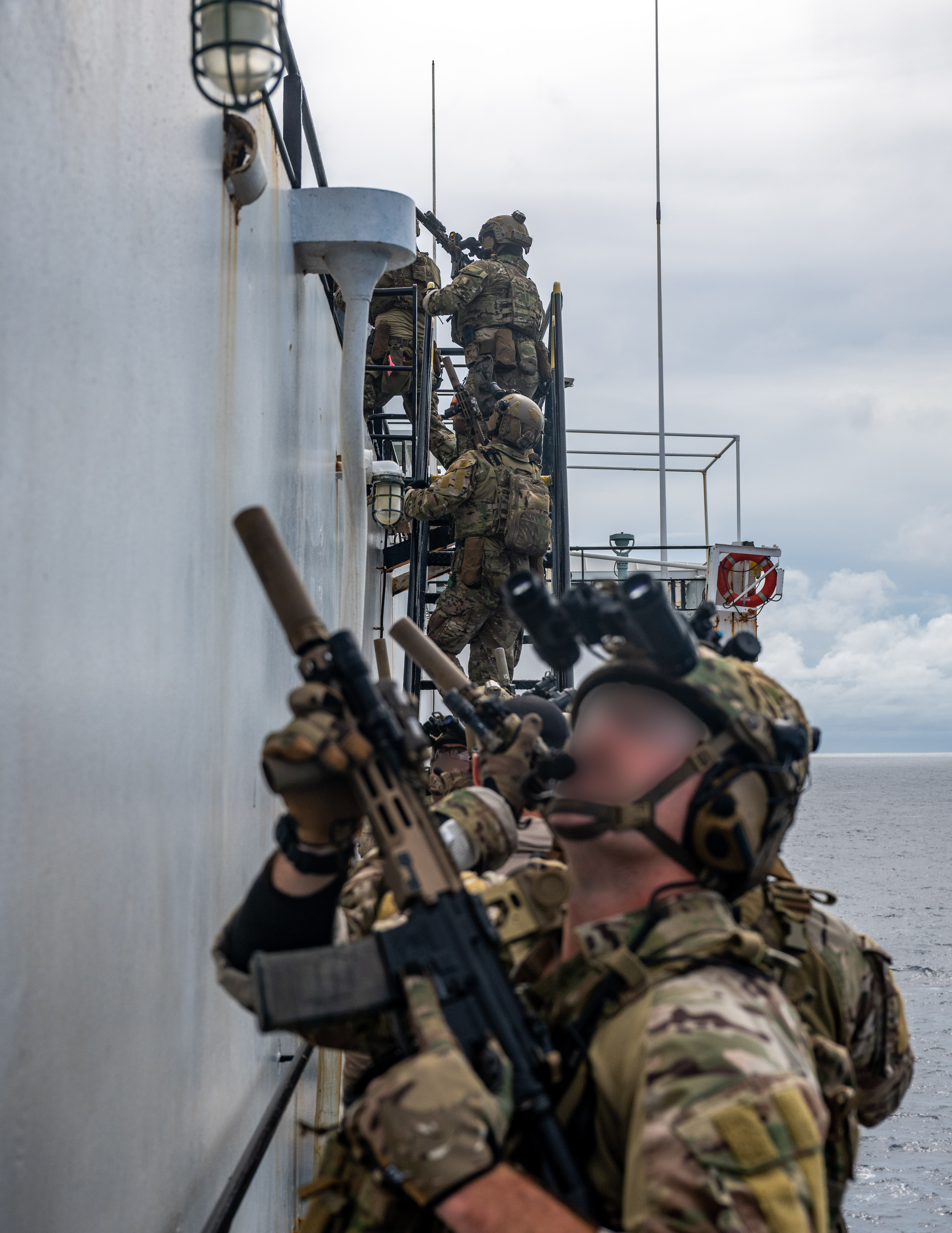 U.S. Naval Special Warfare operators and U.S. Coast Guard Maritime Security Response Team (West) members conduct visit, board, search, and seizure training aboard the 2nd Lt. John P. Bobo-class cargo ship USNS PFC Dewayne T. Williams (T-AK 3009) in the Andaman Sea, Dec. 16, 2024.