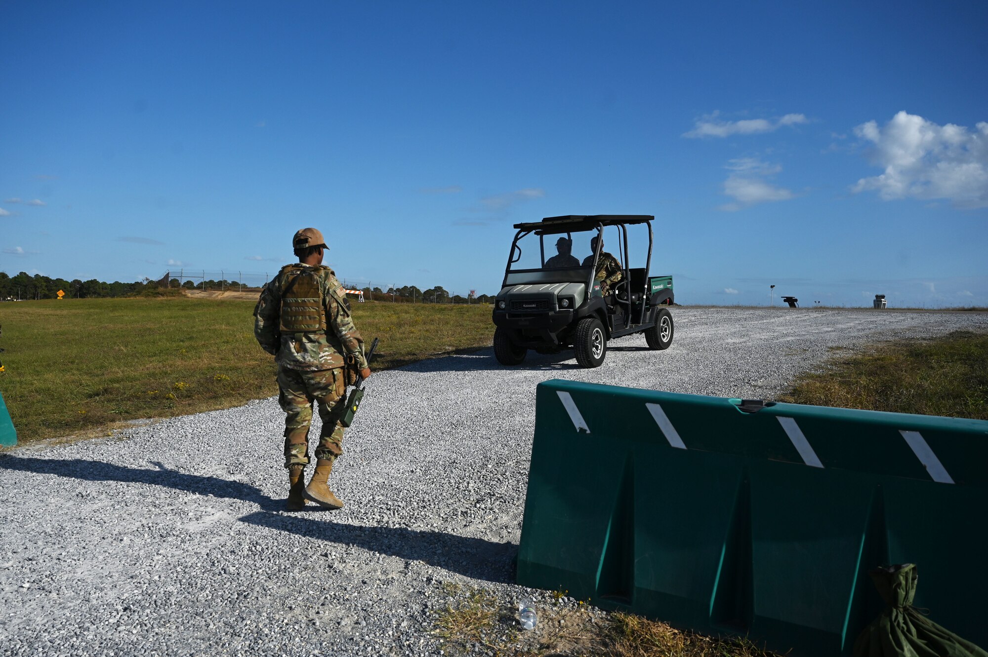 a person stands guard at a check point