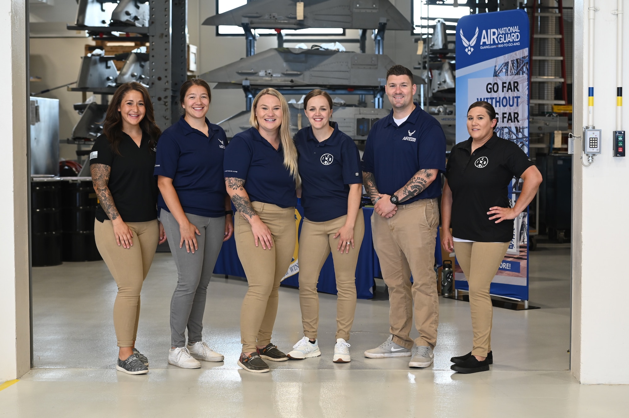 Recruiters stand together prior to the start of the June 2024 Career Fair.
