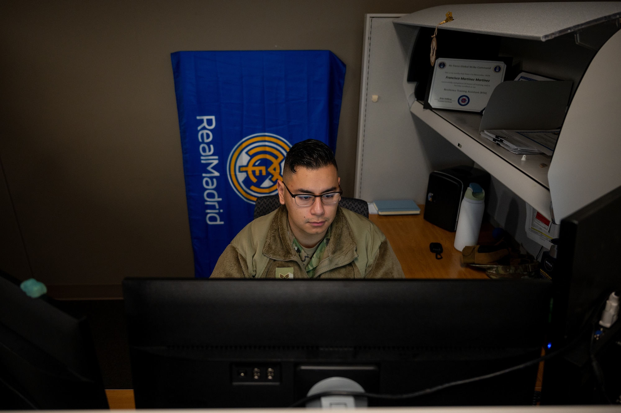 SrA Francisco Martinez, 509th Contracting Squadron contracting officer, works on contracts.