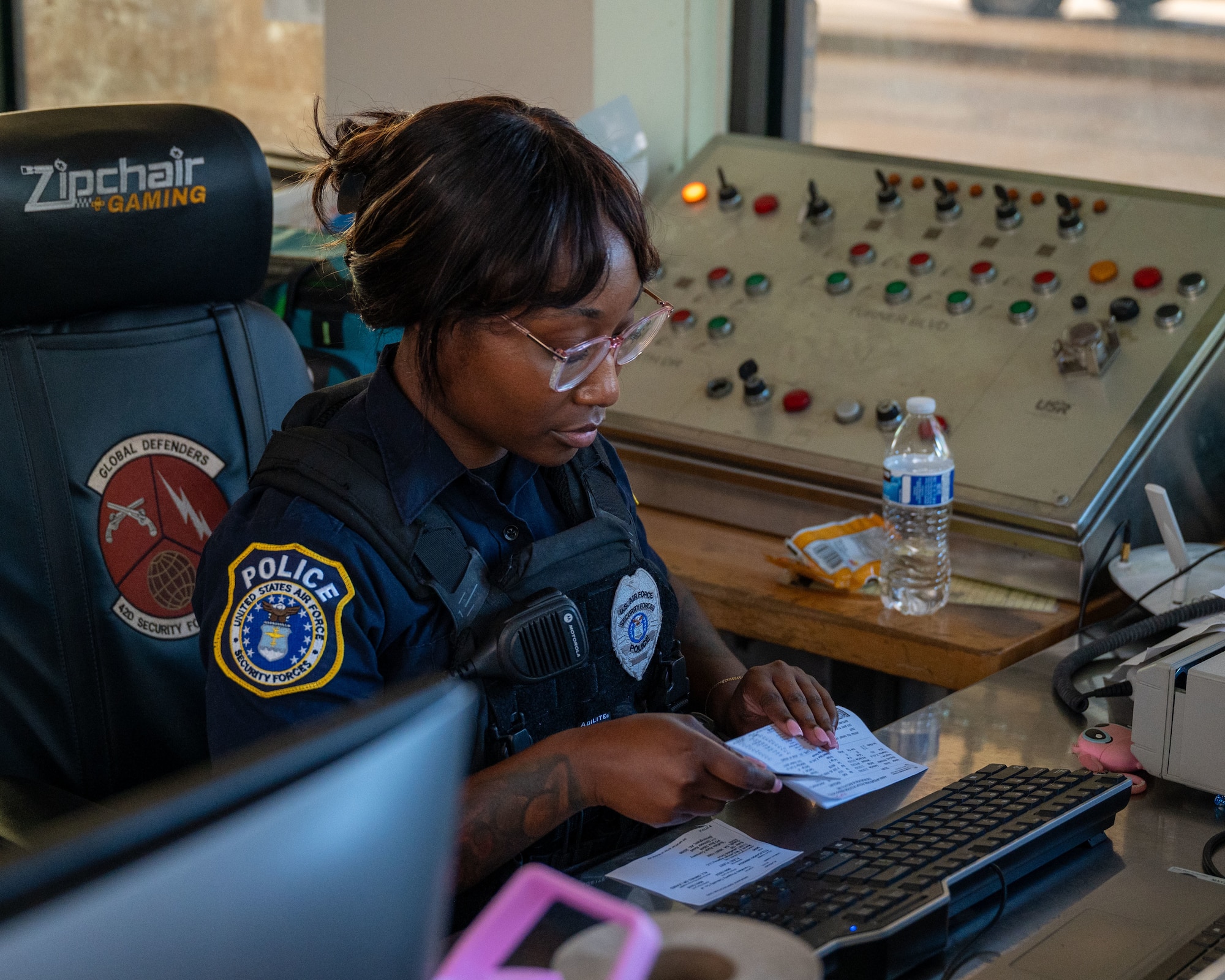 Whitney Motley, 42nd Security Force Squadron police officer, runs a background check for a vehicle inspection at Maxwell Air Force Base-Gunter Annex, Alabama, Dec. 18, 2024.