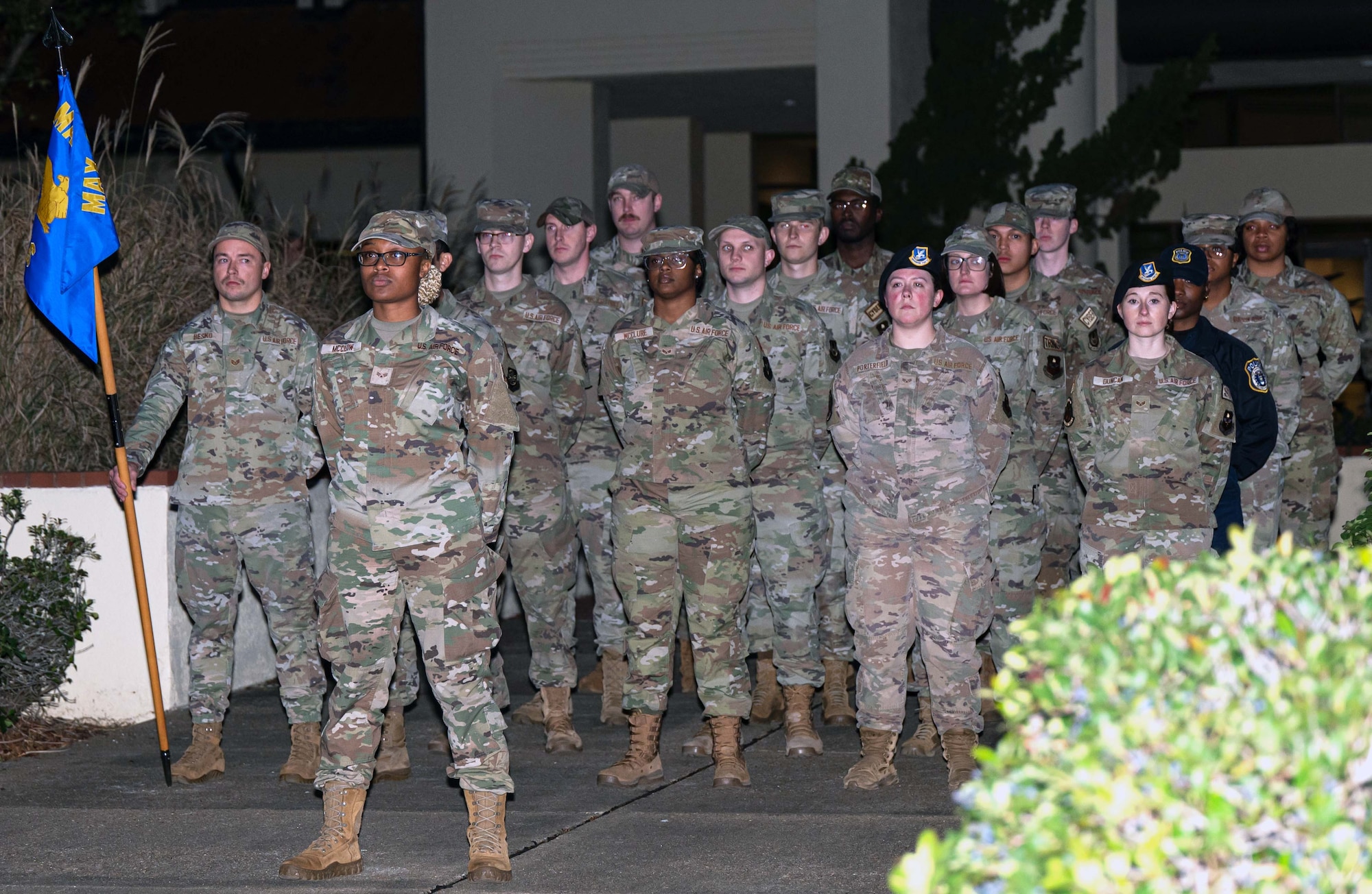 Whitney Motley, center right, 42nd Security Force Squadron police officer, stands in formation with U.S. Airmen in Airmen Leadership School during retreat at Maxwell Air Force Base, Alabama, Dec. 2, 2024.