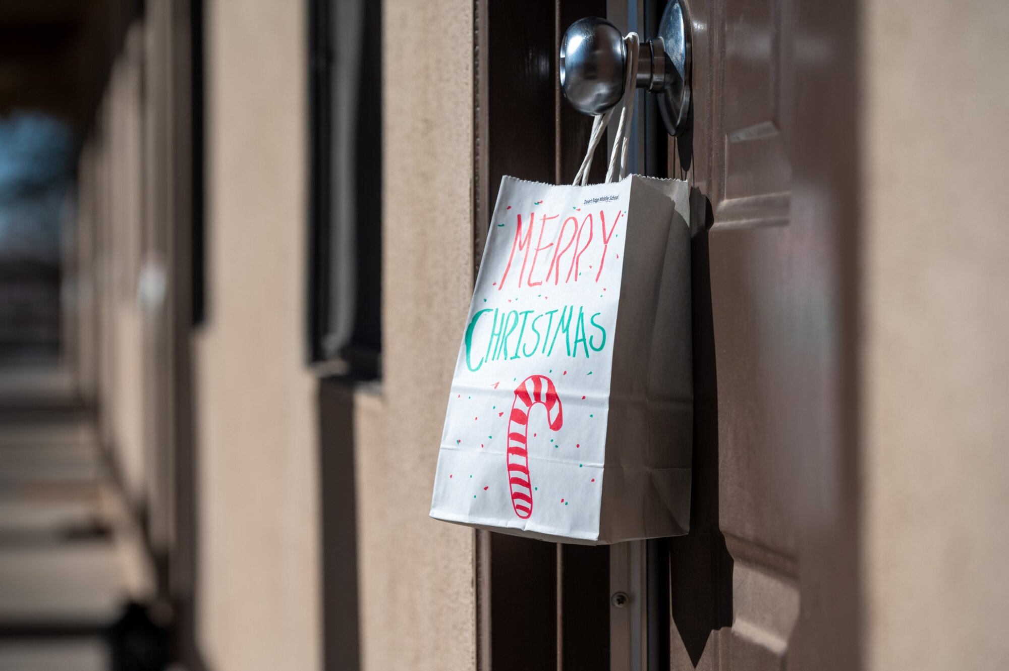 bag of cookies hangs from a door knob