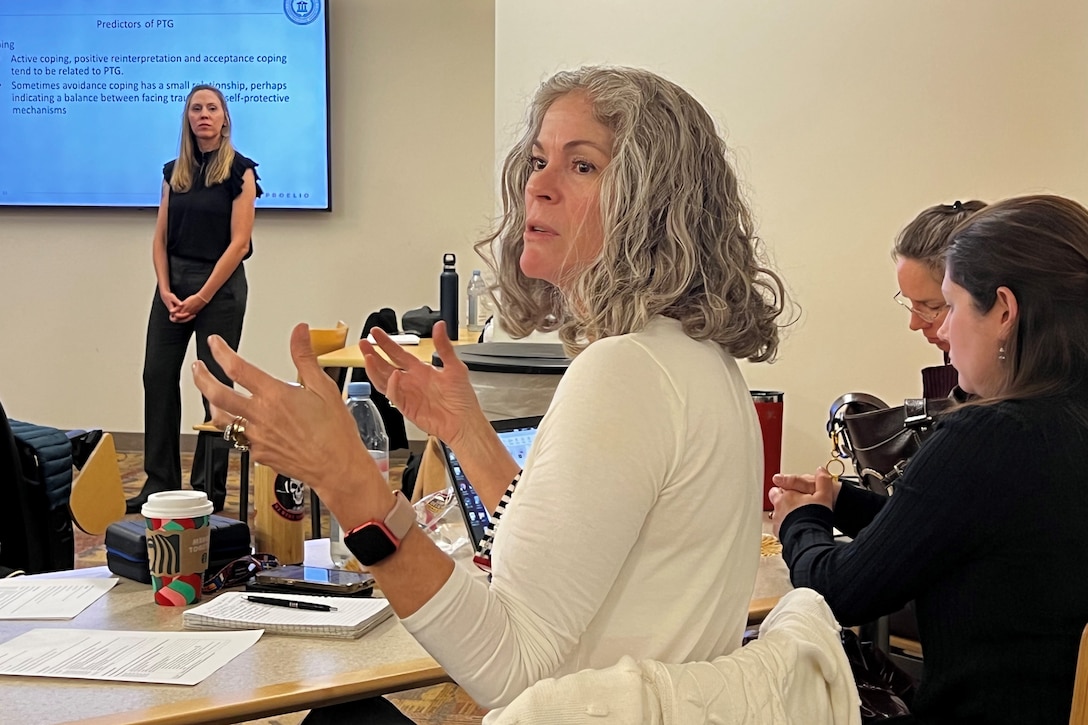 ARCP Behavioral Health Consultant Krista Argiolas answers questions at a Summit for Post-Traumatic Growth at Fort Belvoir. December 4, 2024