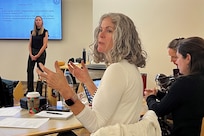 ARCP Behavioral Health Consultant Krista Argiolas answers questions at a Summit for Post-Traumatic Growth at Fort Belvoir. December 4, 2024