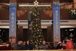 U.S. Soldiers, civilians, distinguished guests, and family members gather to celebrate the holiday season during an annual tree lighting ceremony at the Dragon Hill Lodge, Yongsan, South Korea, Dec. 17, 2024. The Area II community enjoyed a night of family-friendly fun, free food, caroling, an ugly sweater contest and pictures with Santa. (U.S. Army photo by Pfc. Caelum Astra)