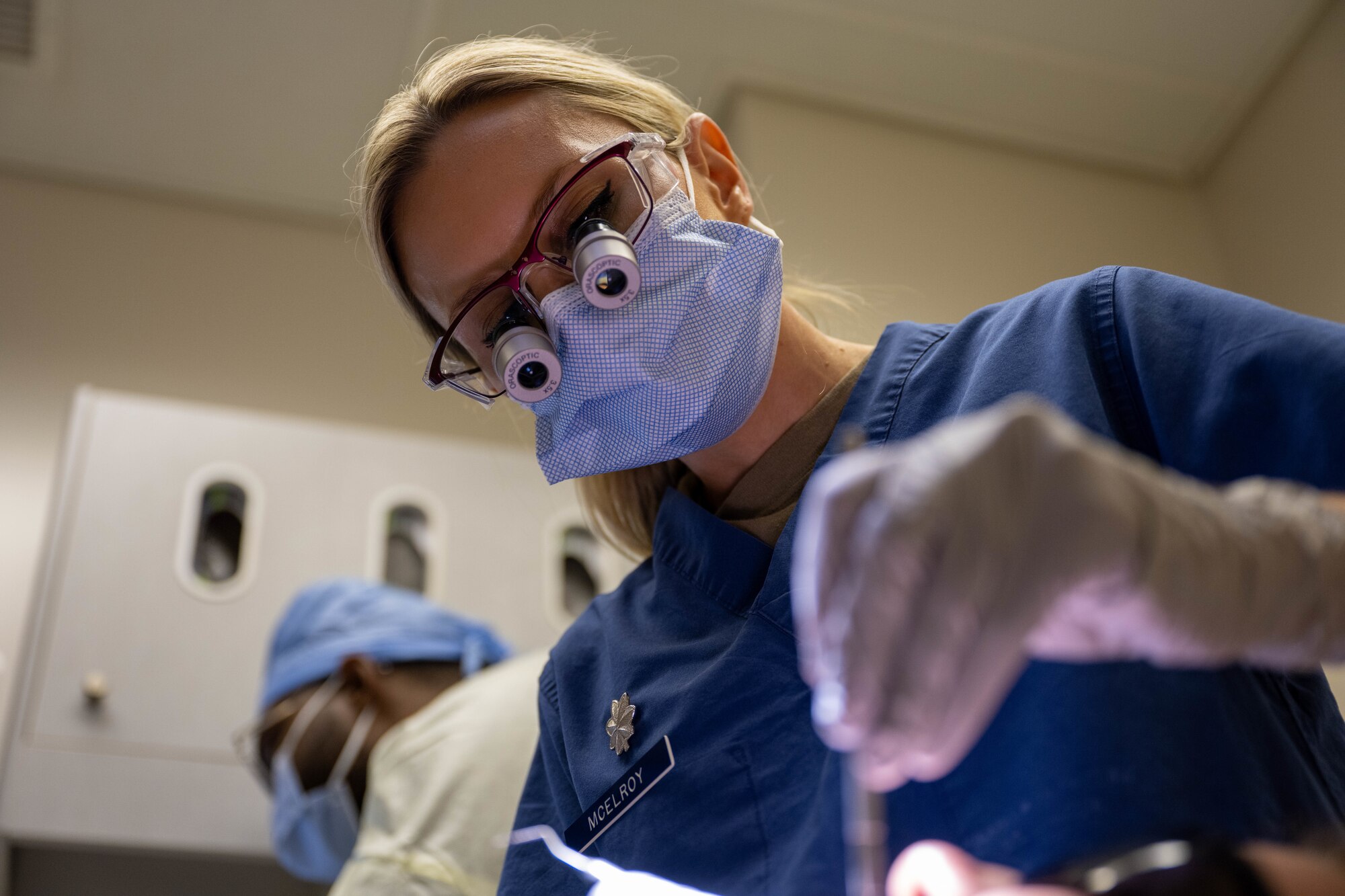 A dentist uses tools to examine a patient's teeth on Joint Base Pearl Harbor-Hickam, Hawaii.