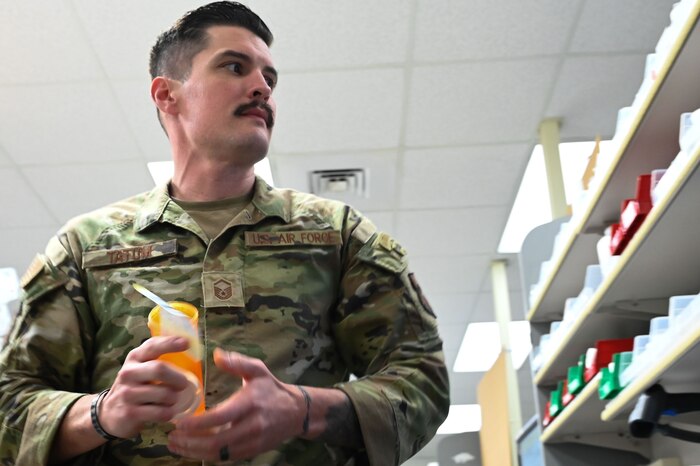 U.S. Air Force Master Sgt. Robert Tatum, 42nd Medical Group pharmacy flight chief, fills a prescription at the pharmacy on Maxwell Air Force Base, Alabama, Dec. 16, 2024.