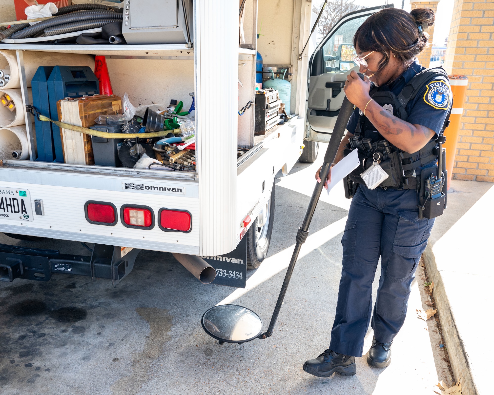 Whitney Motley, 42nd Security Force Squadron police officer performs a security sweep at Maxwell Air Force Base-Gunter Annex, Alabama, Dec. 18, 2024.