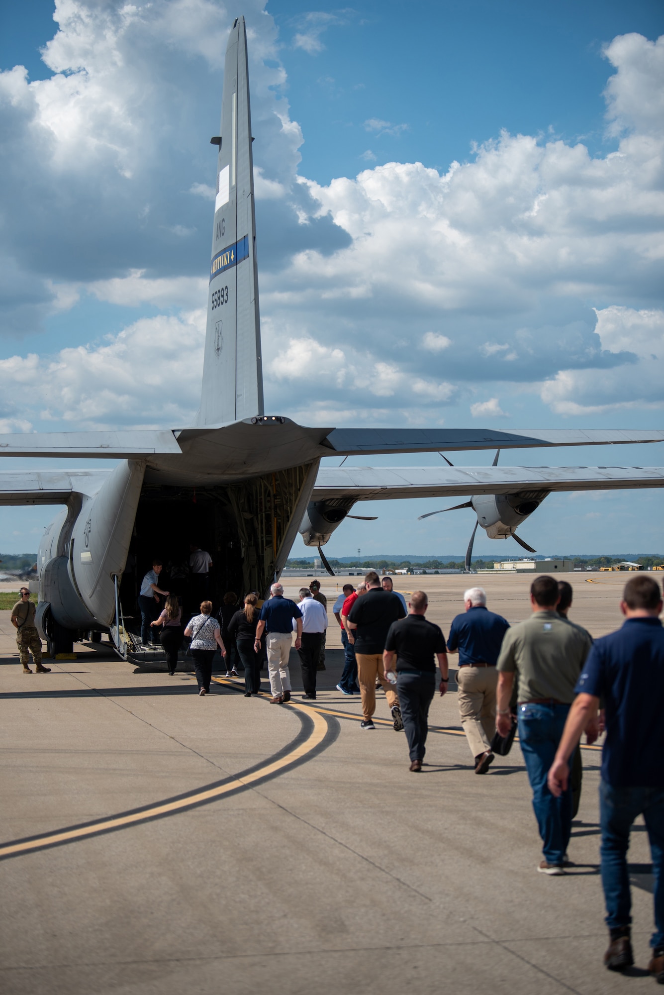 A group of civilian employers boards a C-130J Super Hercules aircraft at the Kentucky Air National Guard Base in Louisville, Ky., Sept. 19, 2024, for an orientation flight to northern Kentucky. The flight was part of an Employer Support of the Guard and Reserve Bosslift, a community outreach program designed to enhance understanding of the Guard mission among civilian employers. (U.S. Air National Guard photo by Phil Speck)