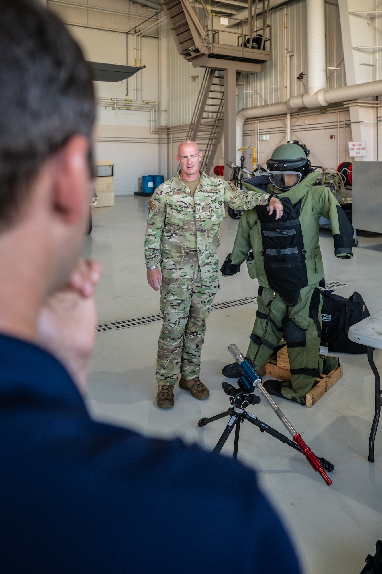 U.S. Air Force Master Sgt. Dustin Turner, an explosive ordnance disposal specialist assigned to the 123rd Airlift Wing, describes the use of a protective bomb to a group of civilian employers at the Kentucky Air National Guard Base in Louisville, Ky., Sept. 19, 2024, as part of an Employer Support of the Guard and Reserve Bosslift. The event, which included an orientation flight aboard a Kentucky Air Guard C-130J Super Hercules aircraft, promotes enhanced understanding of the Guard mission among the civilian community. (U.S. Air National Guard photo by Dale Greer)