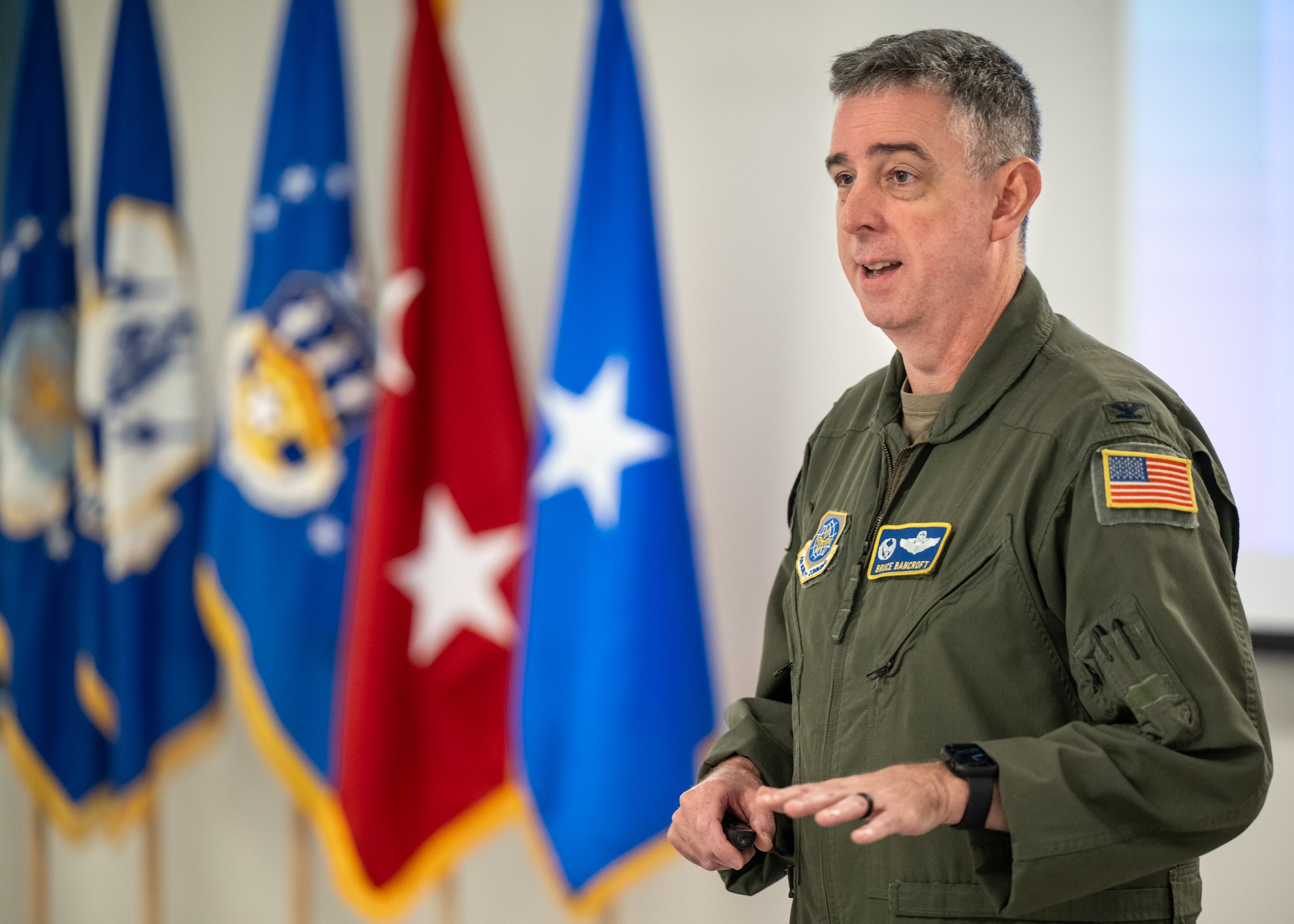 U.S. Air Force Col. Bruce Bancroft, outgoing commander of the 123rd Airlift Wing, speaks to a group of civilian employers at the Kentucky Air National Guard Base in Louisville, Ky., Sept. 19, 2024, as part of an Employer Support of the Guard and Reserve Bosslift. The event, which included an orientation flight aboard a Kentucky Air Guard C-130J Super Hercules aircraft, promotes enhanced understanding of the Guard mission among the civilian community. (U.S. Air National Guard photo by Dale Greer)