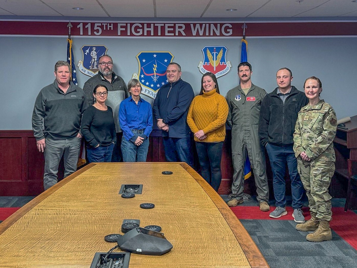 Members of the 115th Fighter Wing safety office pose with OSHA representatives following the unit's recognition for the Voluntary Protection Program Star status at Truax Field in Madison Wisconsin on Sept. 11, 2024.