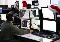 A New York Air National Guardsman assigned to the  Eastern Air Defense Sector in Rome, New York, prepares for NORAD Santa tracking operations. The annual NORAD Tracks Santa operation traces St. Nick's path around the world on Dec. 24.