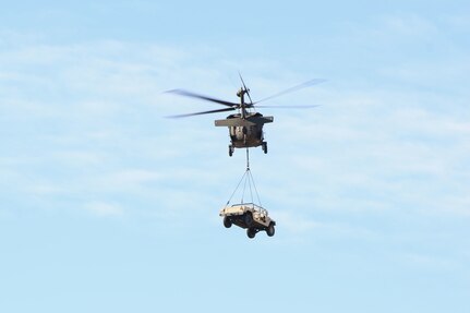 Virginia Army National Guard Soldiers assigned to the Lynchburg-based Headquarters Company, 1st Battalion, 116th Infantry Regiment, 116th Infantry Brigade Combat Team conduct sling load training Dec. 7, 2024, at Blackstone Army Airfield in Blackstone, Virginia.