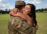 Man and woman embrace each other.