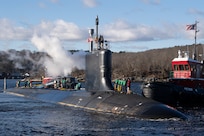 The pre-commissioning unit (PCU) Iowa (SSN 797) arrives for the first time at Naval Submarine Base New London in Groton, Connecticut, December 19, 2024. The future USS Iowa was delivered to Submarine Squadron (SUBRON) 4 from General Dynamics Electric Boat shipbuilding facility down river after recently completing a series of at-sea testing.